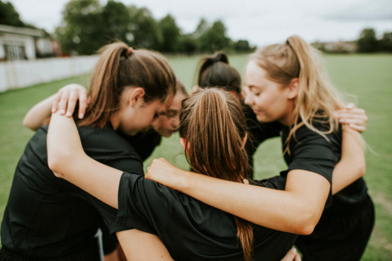 Rugby players huddle before a match